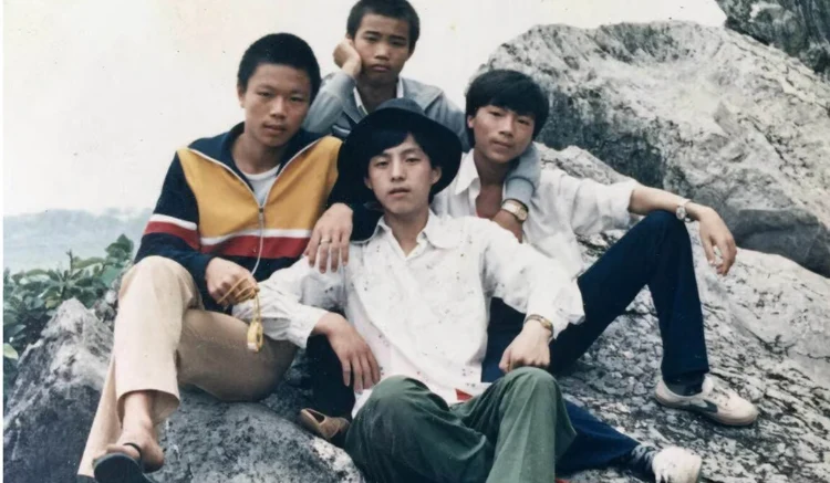 Li Hua (in the hat) hanging out with friends before he got sick.