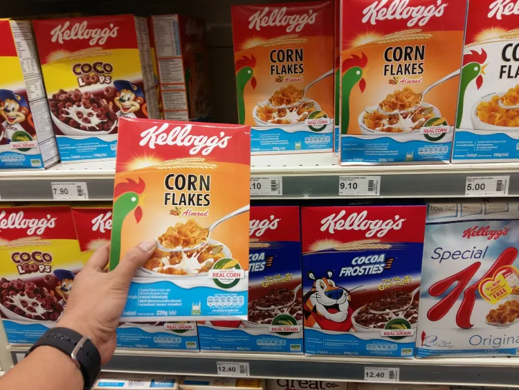 Man holding corn flakes breakfast cereal. 