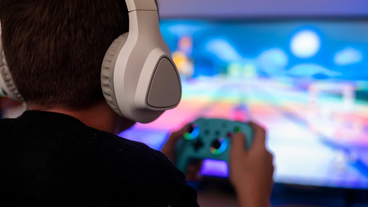 A boy playing video game A boy playing video game.