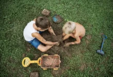Children playing in dirt.
