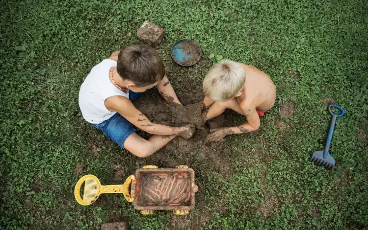 Children playing in dirt.