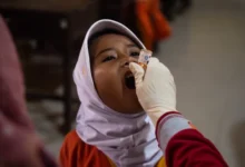 A child getting polio vaccine.