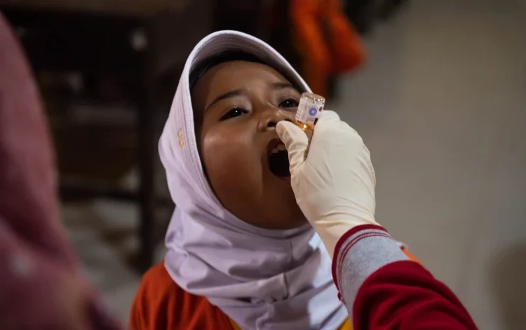 A child getting polio vaccine.