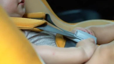 Baby in car seat.