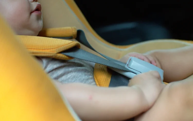 Baby in car seat.