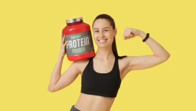 Woman with jar of protein powder.