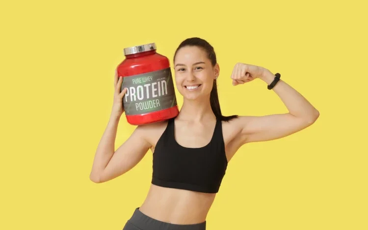 Woman with jar of protein powder.