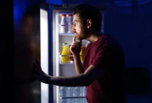 Man looking for food late at night.