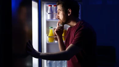 Man looking for food late at night.
